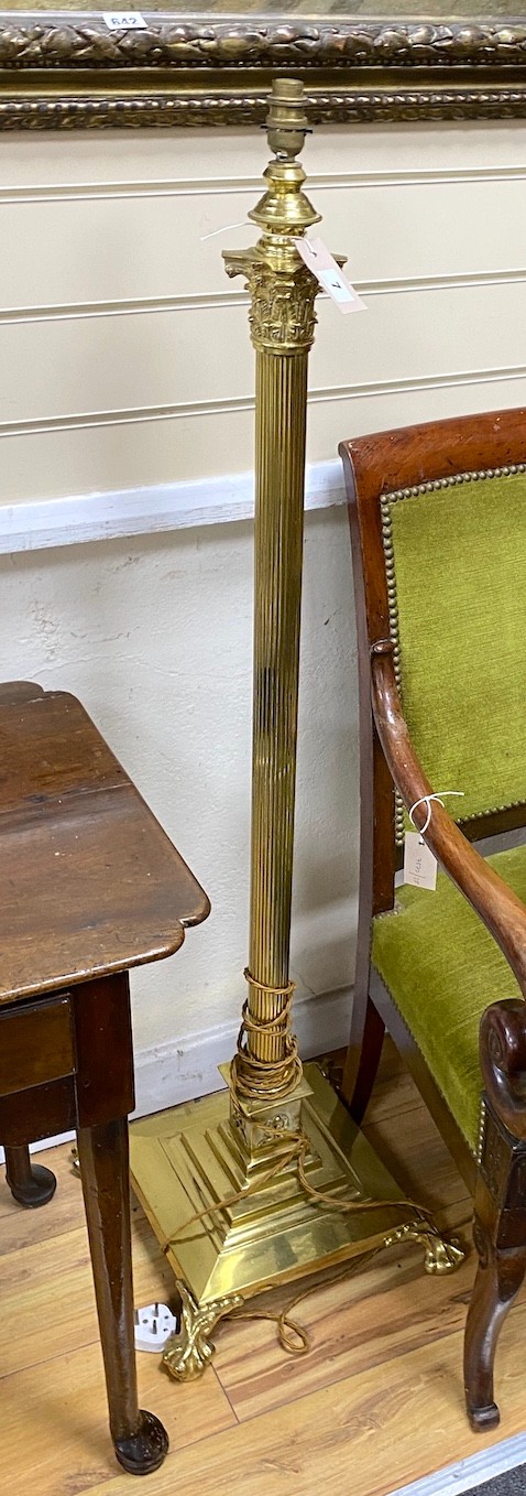 A near pair of brass telescopic Corinthian column standard lamps